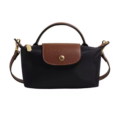 Mini leather pouch, black with brown front flap, gold snap, top handle and shoulder strap