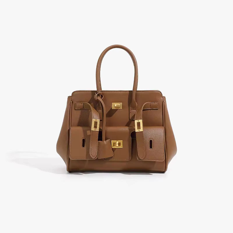 Brown structured handbag with top handles and gold-tone hardware, front view