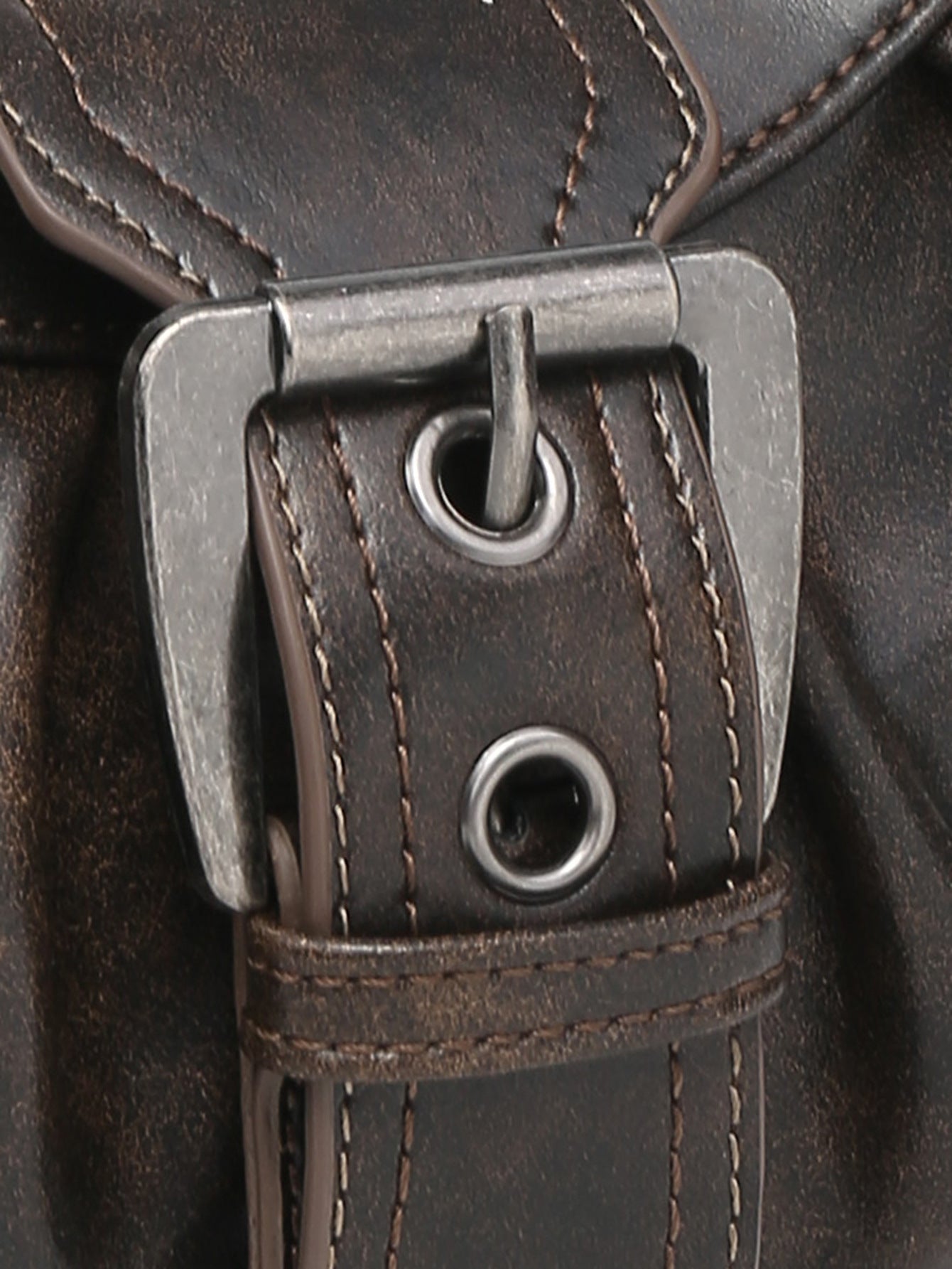Brown distressed faux leather hobo bag buckle with metal grommets and strap detail