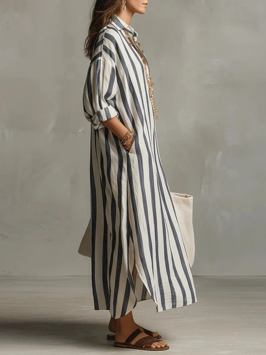 Striped linen shirt dress in blue and white vertical stripes, side view, button front