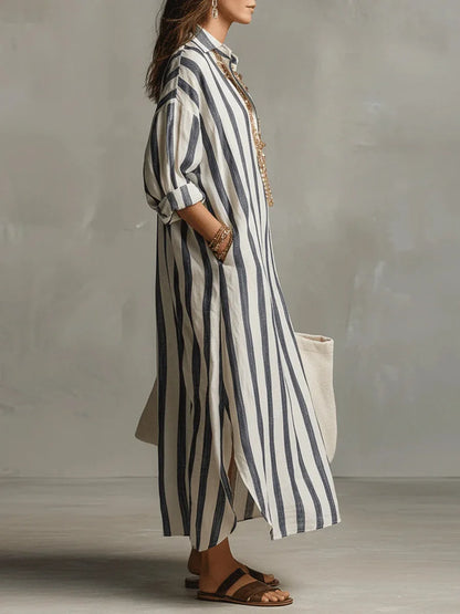Striped linen shirt dress in blue and white vertical stripes, side view, button front