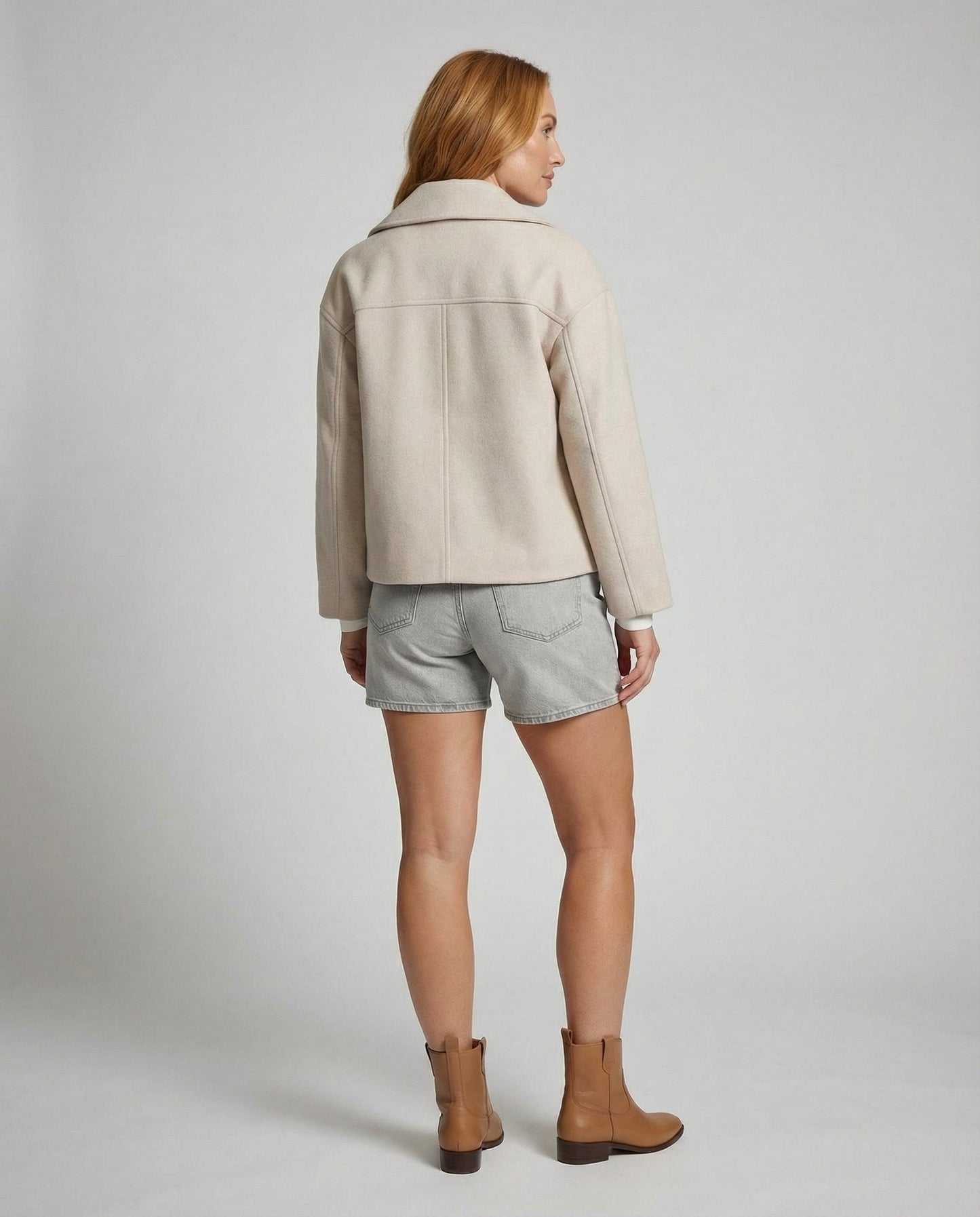 Cropped double-breasted jacket back view in light beige with yoke seam