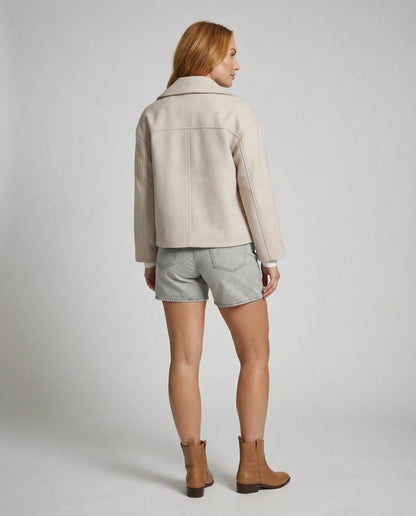 Cropped double-breasted jacket back view in light beige with yoke seam