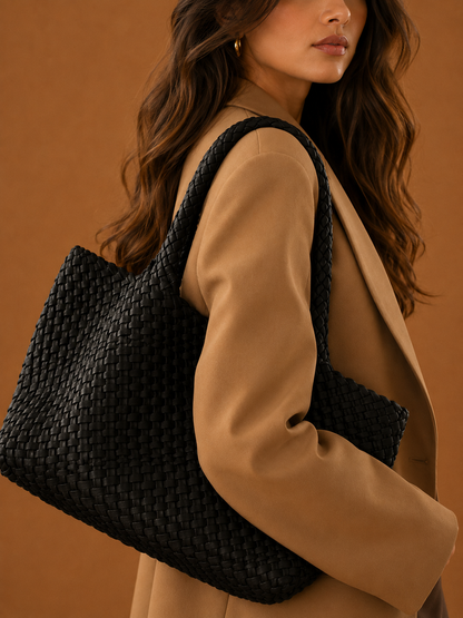 Black woven tote bag with braided shoulder handles and open top