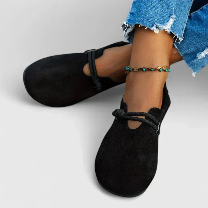 Black slip-on walking shoes with elastic strap and rounded toe