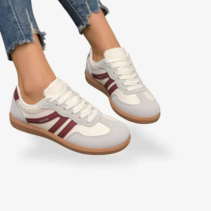 White comfort trainers with burgundy triple stripes, lace-up style and tan gum sole