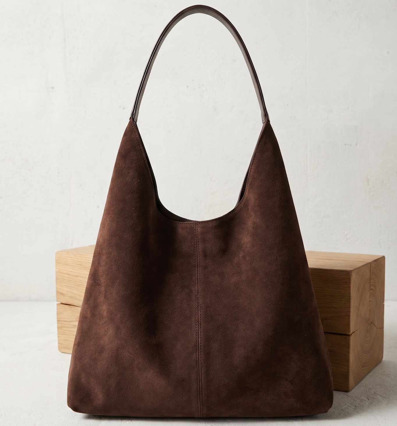 Brown vegan suede tote bag with curved handles and central vertical seam