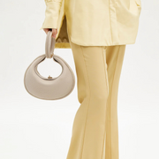 Off-white convertible handbag with top handle and circular front detail