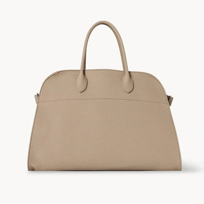 Beige leather tote bag with two top handles and minimal hardware