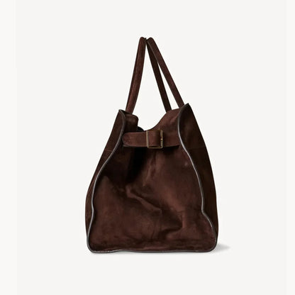 Brown suede tote bag with top handles and front buckle strap