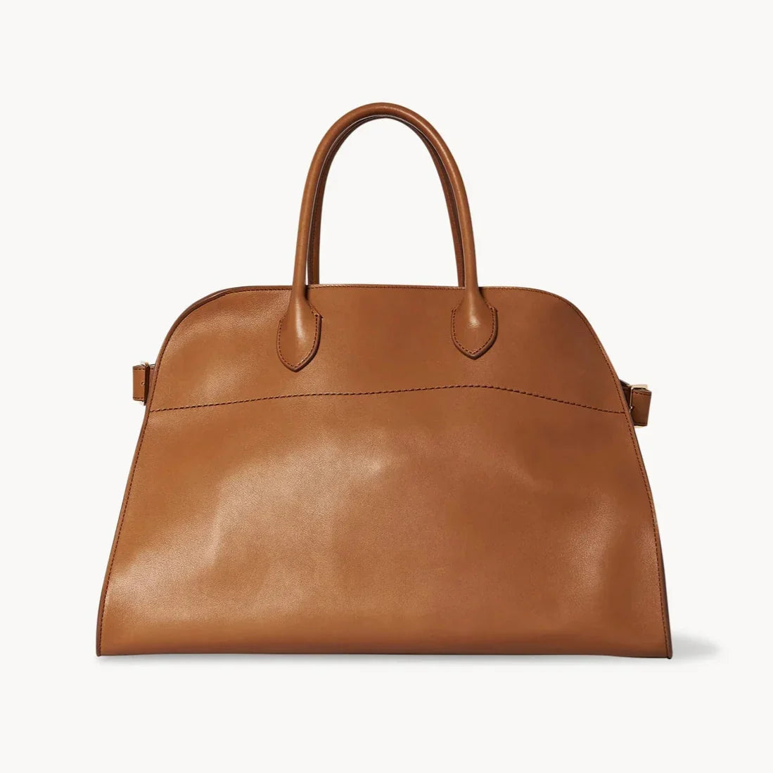 Tan leather satchel with two top handles and small side buckle details