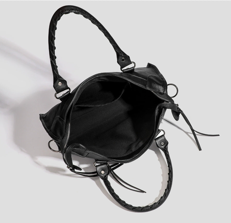 Black vegan leather tote bag, open top with side zip and adjustable crossbody strap