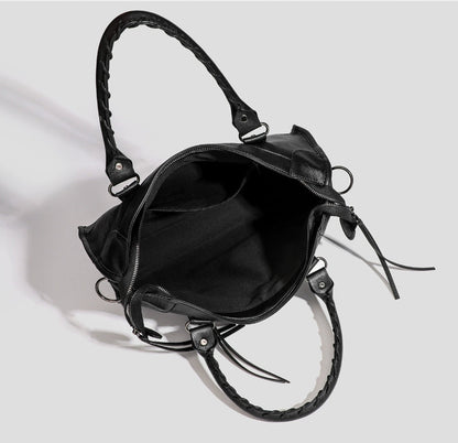 Black vegan leather tote bag, open top with side zip and adjustable crossbody strap