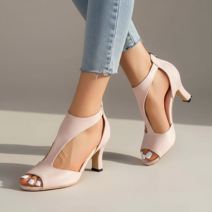 Pink supportive heeled sandals with open toe and ankle strap