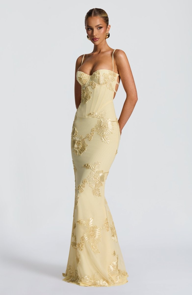 Light yellow strapless lace maxi dress with allover floral appliqué, fitted.