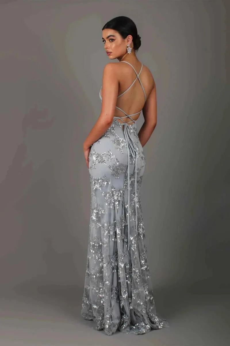 Silver sequin evening dress back view with crisscross straps and fitted mermaid skirt