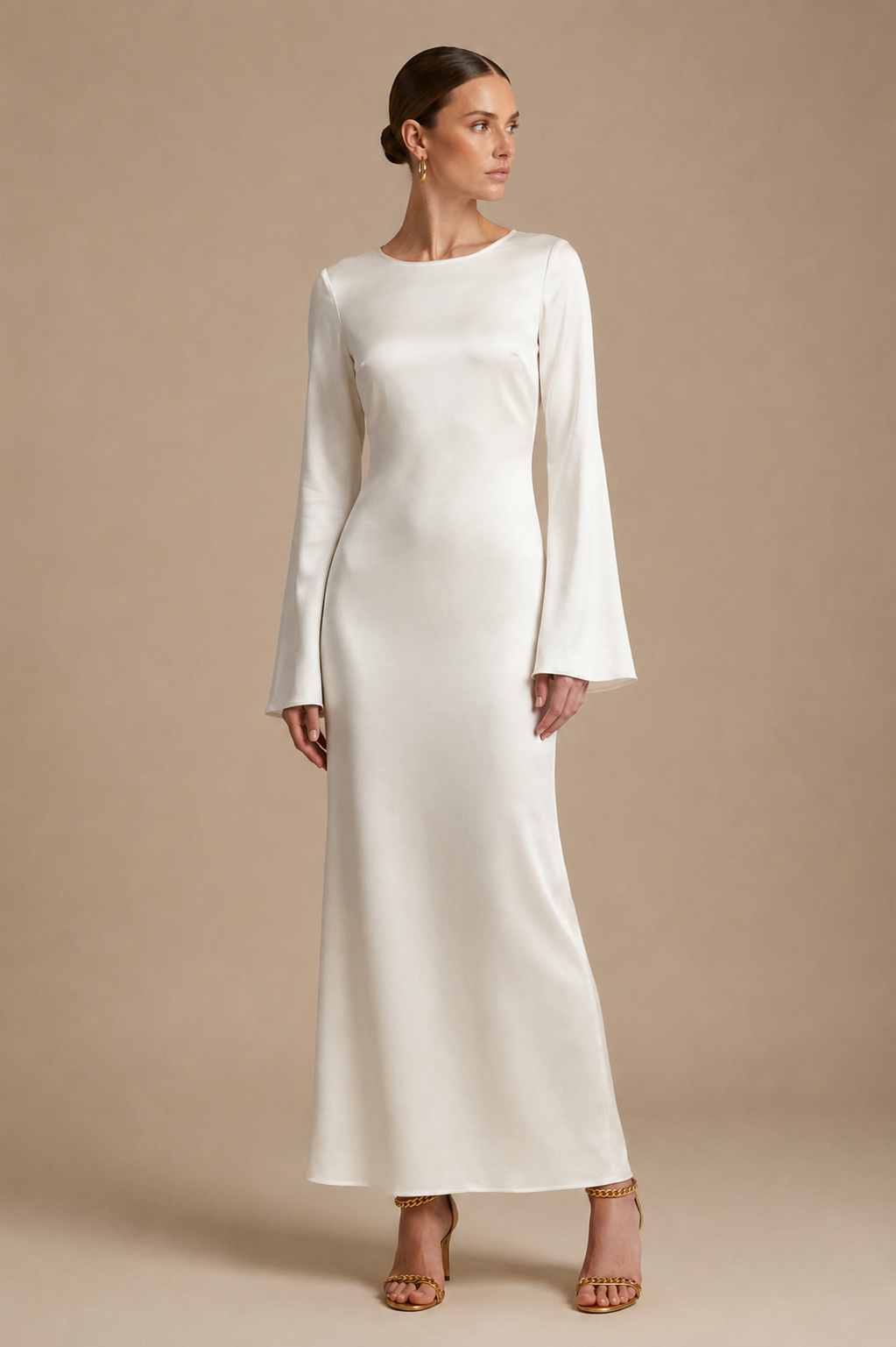 Cream satin maxi dress with long sleeves and straight, fitted skirt