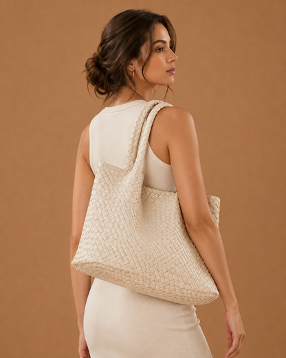 Off-white woven tote bag with braided handles and open top