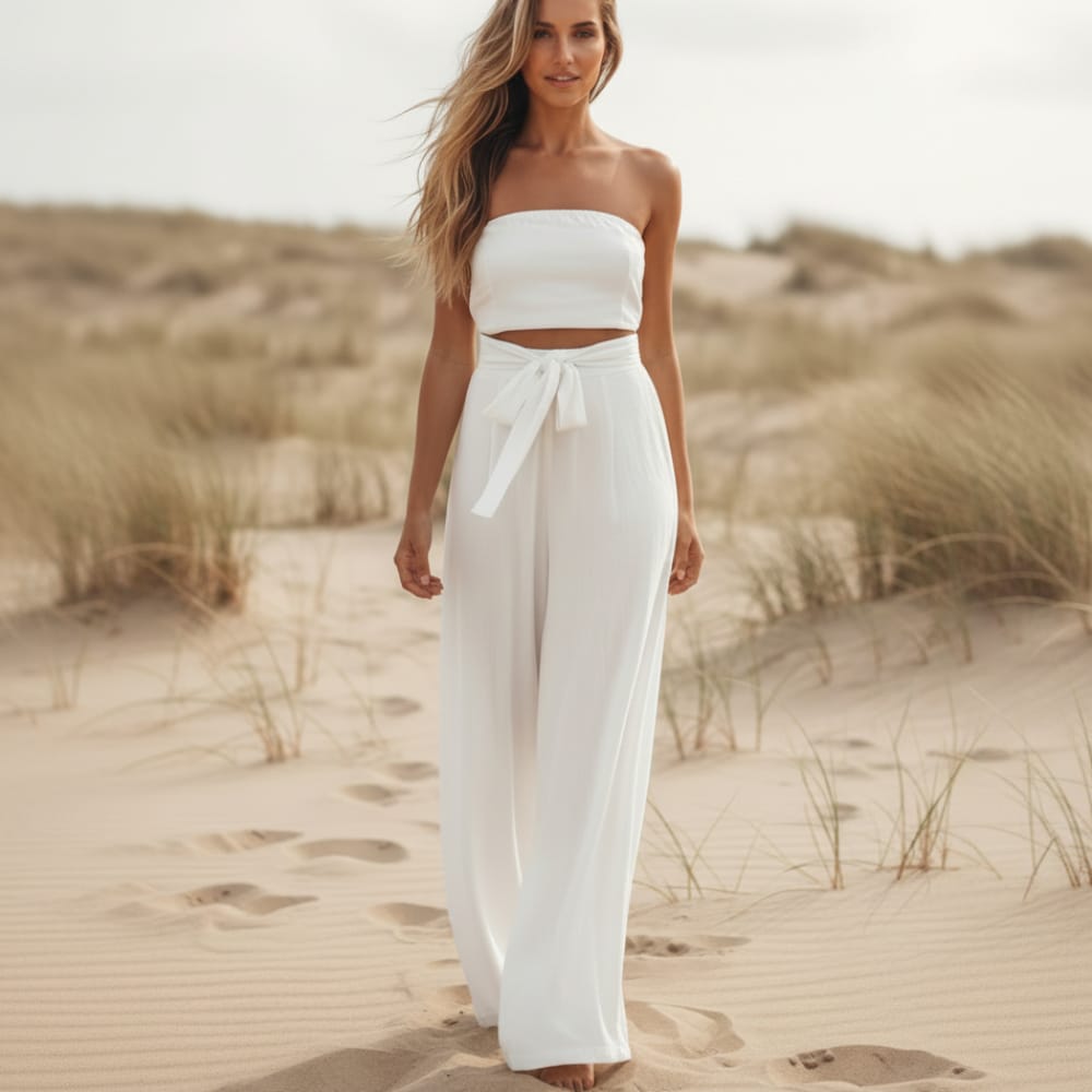 White strapless wide-leg jumpsuit, tie waist, flowing wide pant legs