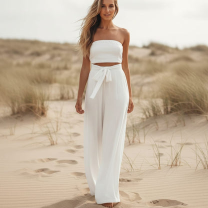 White strapless wide-leg jumpsuit, tie waist, flowing wide pant legs