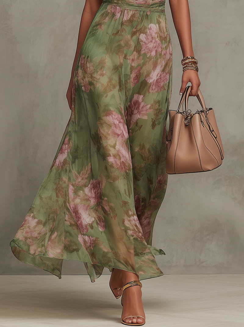 Green floral halterneck midi dress with flowing skirt and side pleats