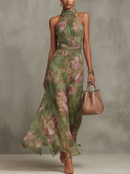 Green floral halterneck midi dress with gathered waist and sleeveless halter neckline