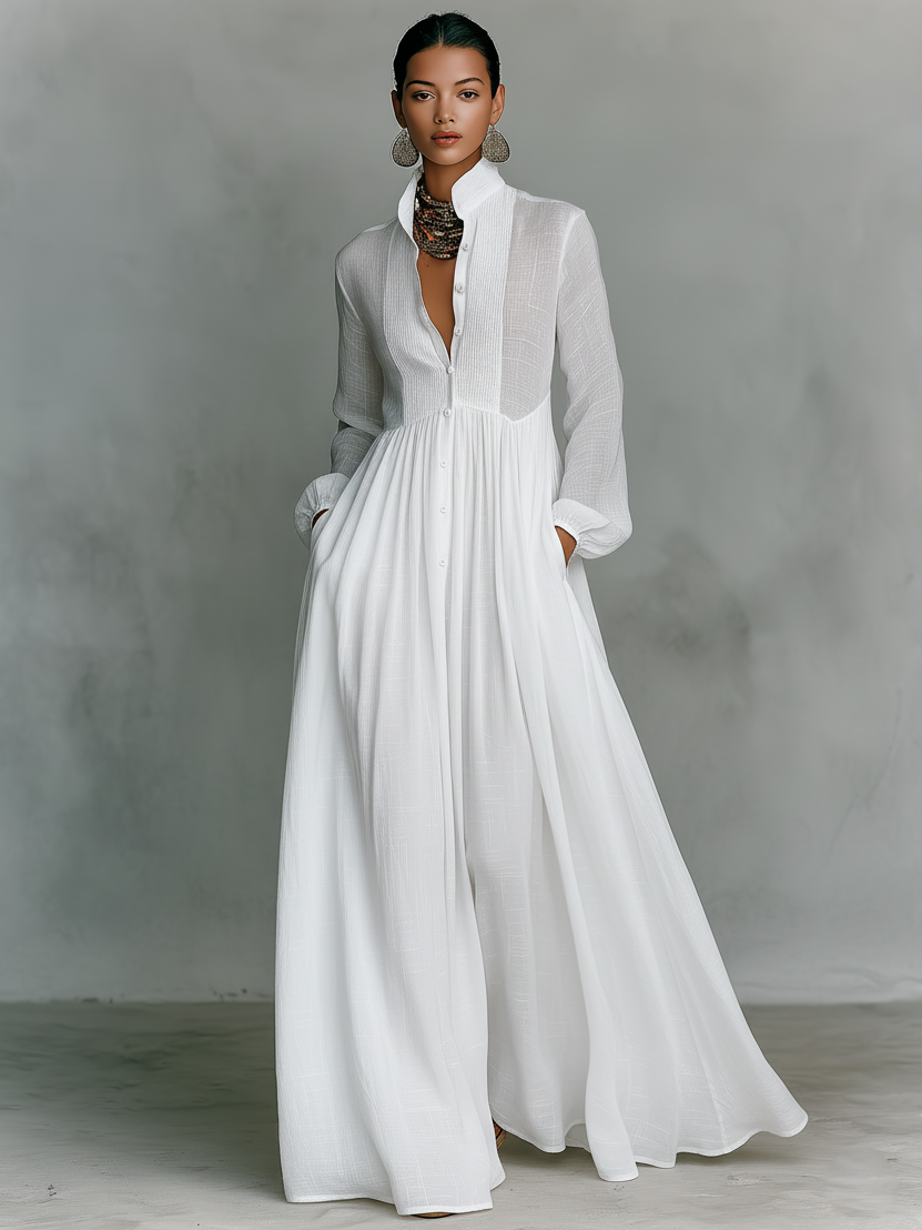 White cotton-linen maxi shirt dress with V-neck, long sleeves, and gathered empire waist