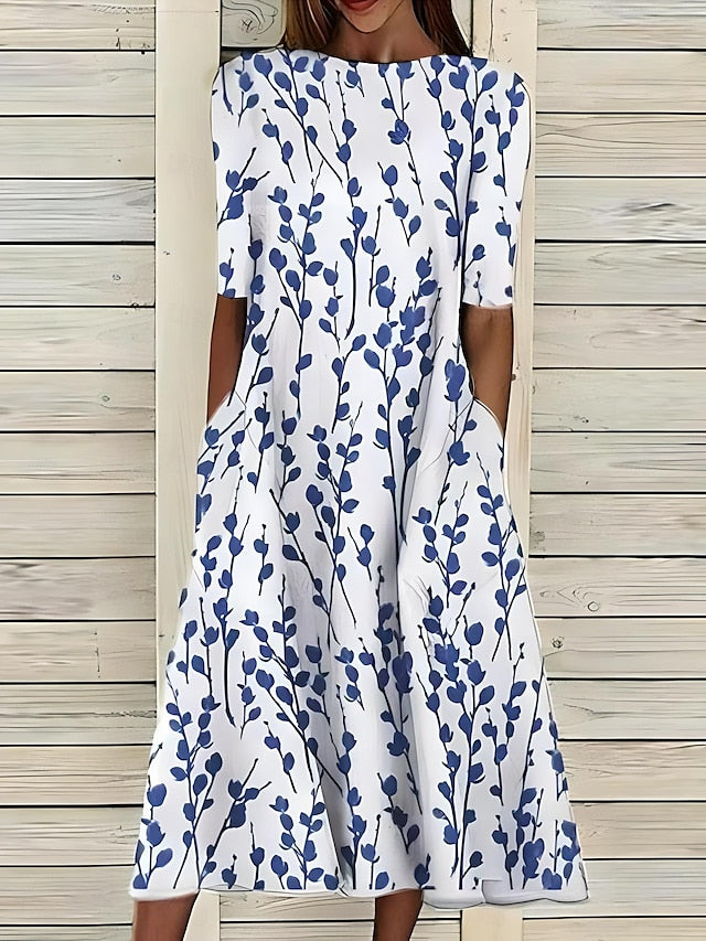 Floral midi dress with blue sprig print, round neckline, short sleeves, midi hem