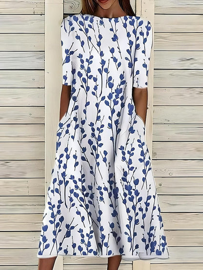 Floral midi dress with blue sprig print, round neckline, short sleeves, midi hem