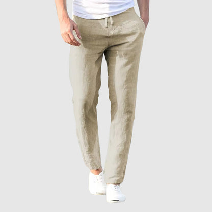 Beige lightweight linen pants with drawstring waist and slim tapered fit