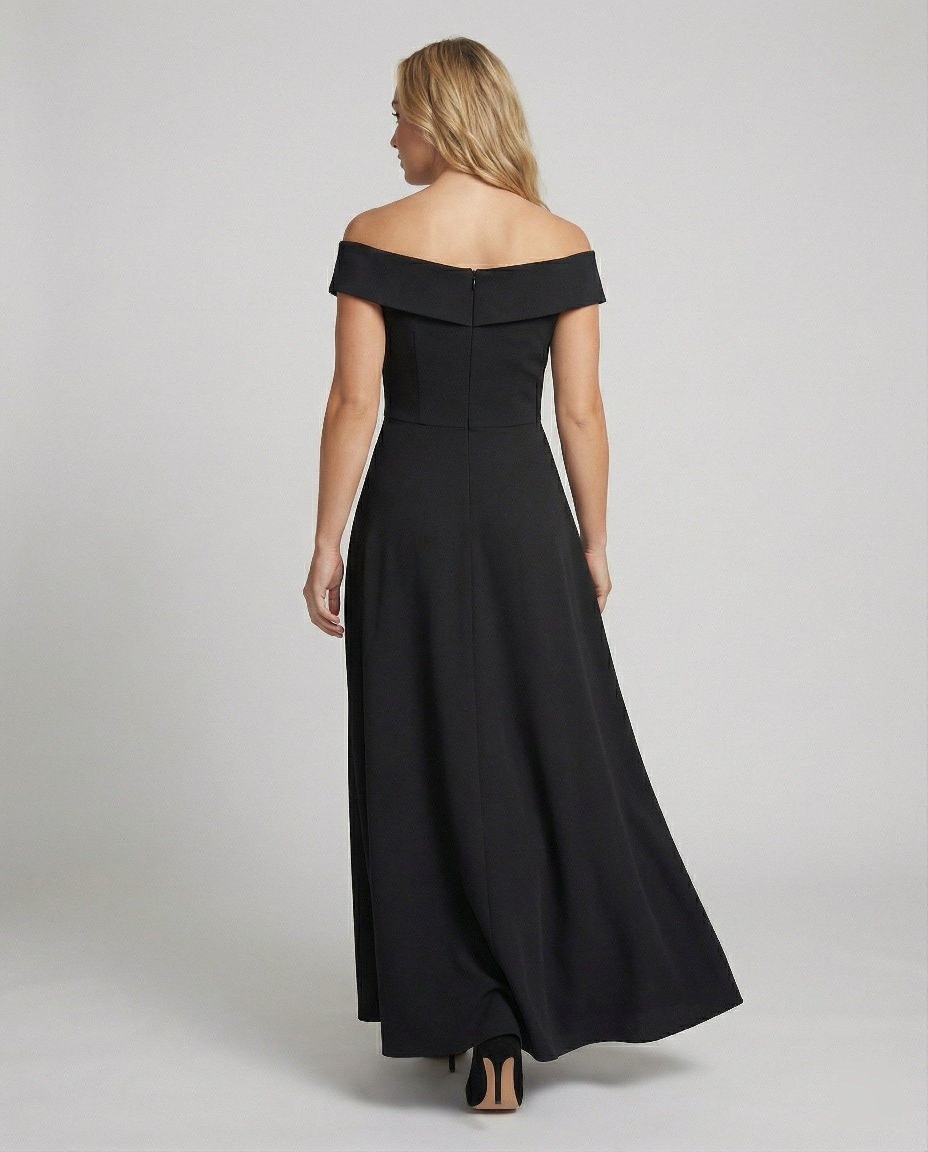 Back view of black off-shoulder long evening dress with wide neckline and flared hem