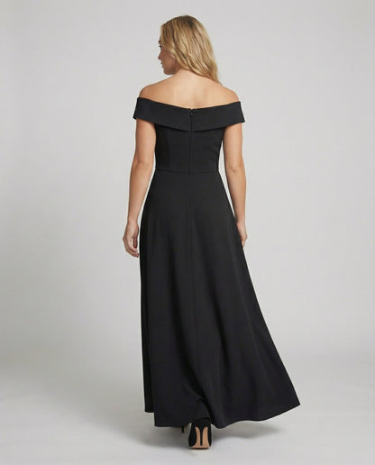 Back view of black off-shoulder long evening dress with wide neckline and flared hem