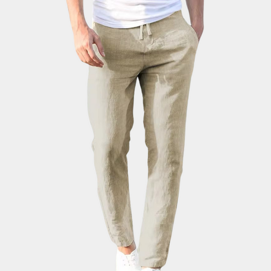 Beige lightweight linen pants with drawstring waist and tapered ankle-length legs