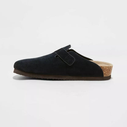 Black suede clog with adjustable buckle strap, side angle view