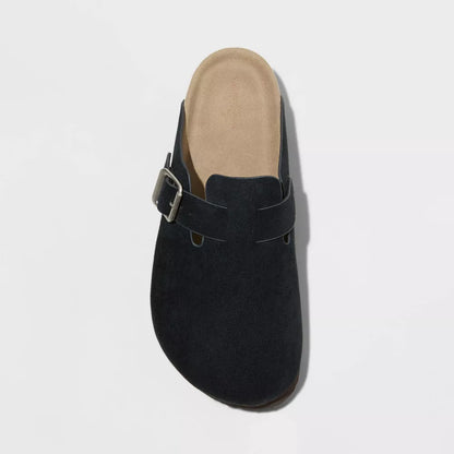 Black suede clog with adjustable buckle strap, side profile view