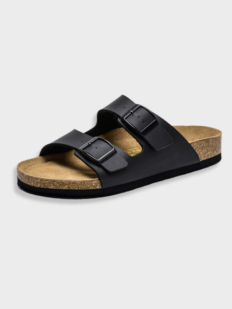 Women's footbed sandals in black with two square buckles and cork-textured sole.