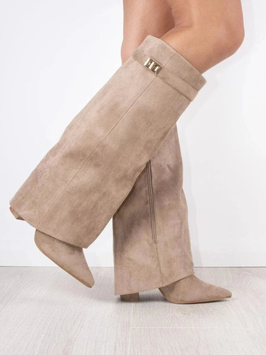 Beige suede heeled boots with square metallic buckle at the cuff