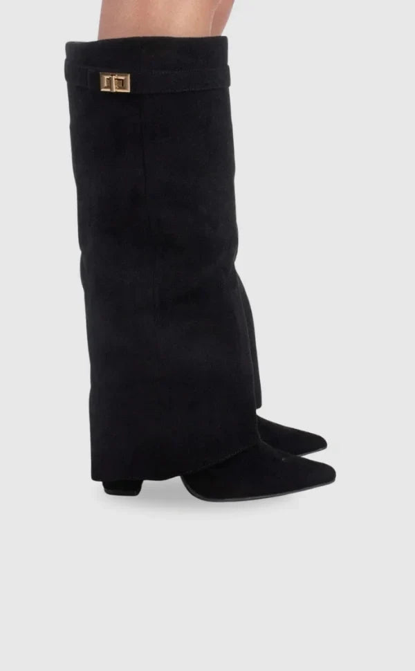 Black suede heeled boots with square metallic buckle at the cuff