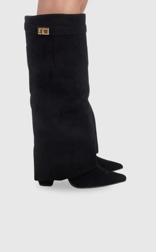 Black suede heeled boots with square metallic buckle at the cuff