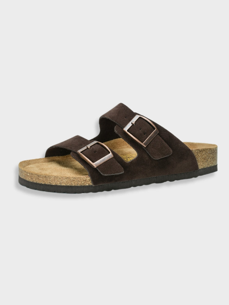 Women's footbed sandals in dark brown with two square buckles and cork-textured sole.