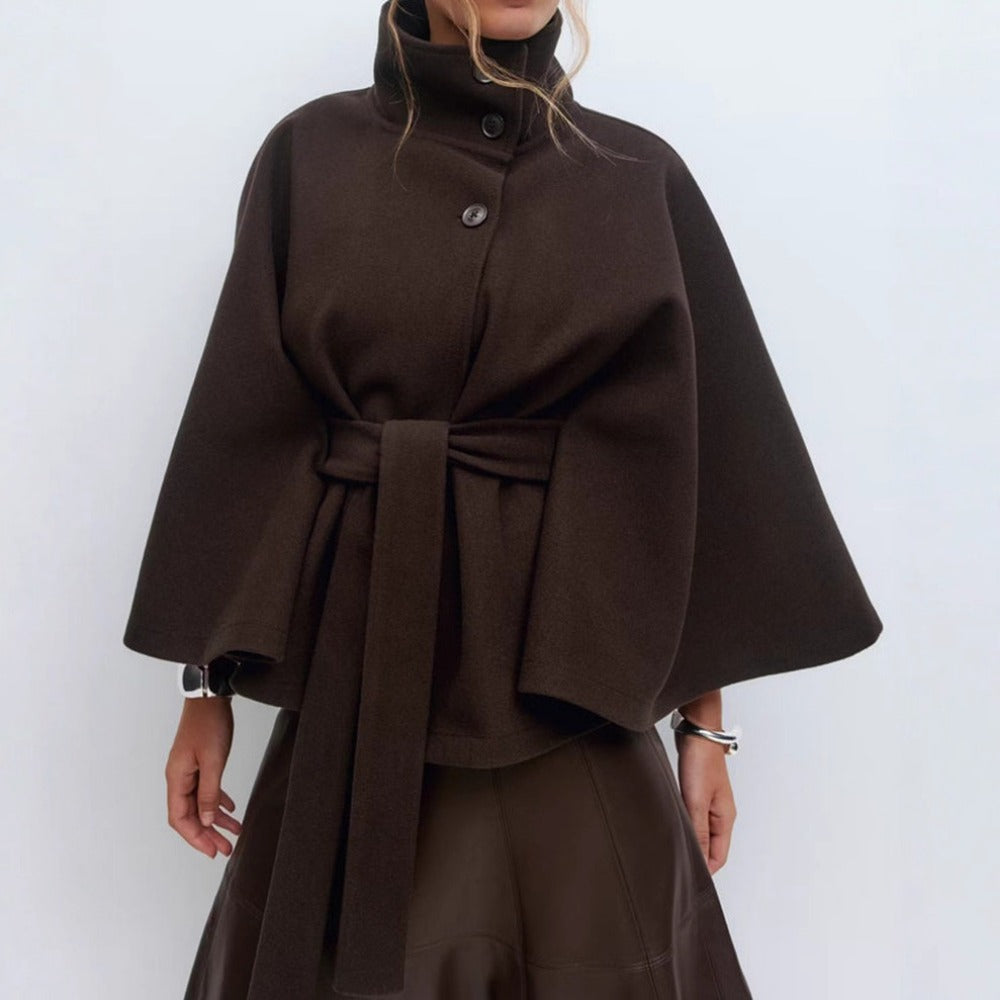 Women’s high-collar cape coat, brown, button front with belt tie and wide cape sleeves.