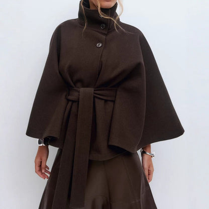 Women’s high-collar cape coat, brown, button front with belt tie and wide cape sleeves.