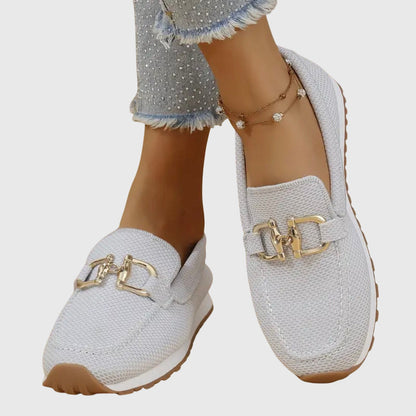 White orthopedic mesh loafers with gold buckle detail and textured sole