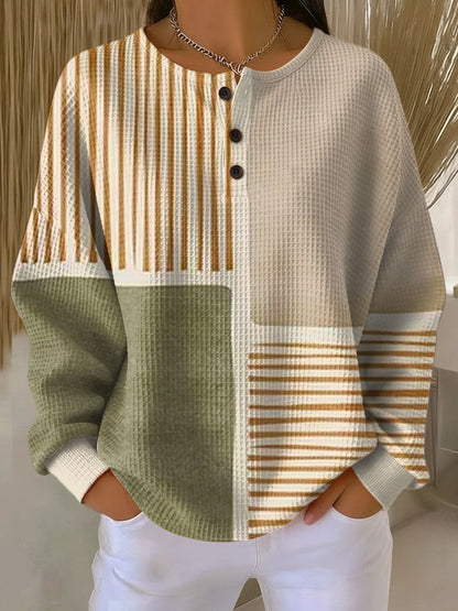Cream waffle-knit henley jumper with vertical stripe color-blocking and black button placket