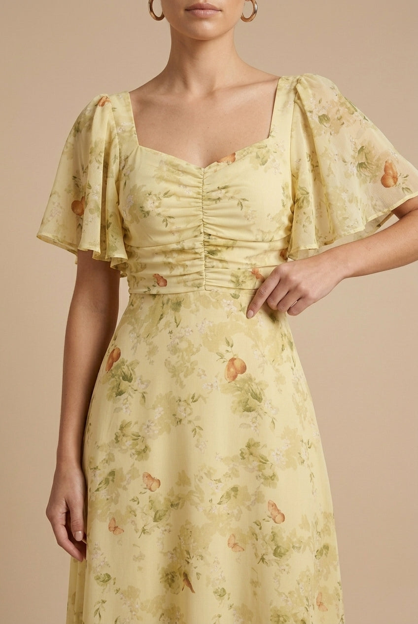 Yellow floral maxi dress with ruched bodice, square neckline and flutter puff sleeves