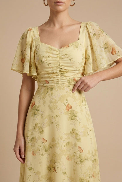 Yellow floral maxi dress with ruched bodice, square neckline and flutter puff sleeves