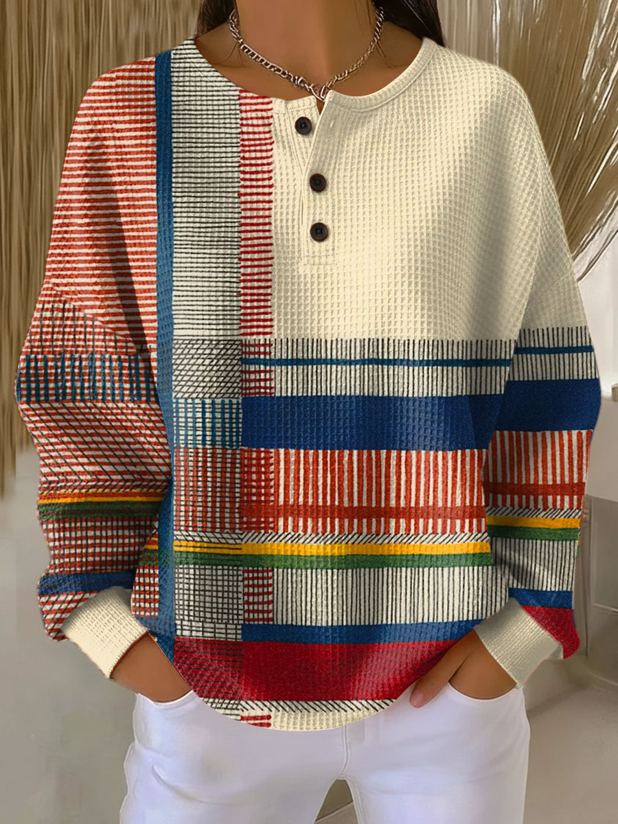 Cream waffle-knit henley jumper with bold multicolor stripe color-block panels and buttons