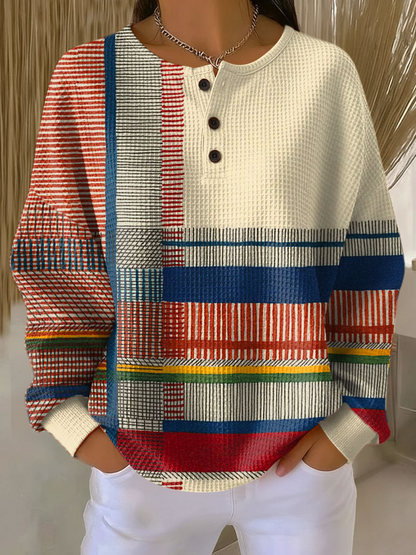 Cream waffle-knit henley jumper with bold multicolor stripe color-block panels and buttons
