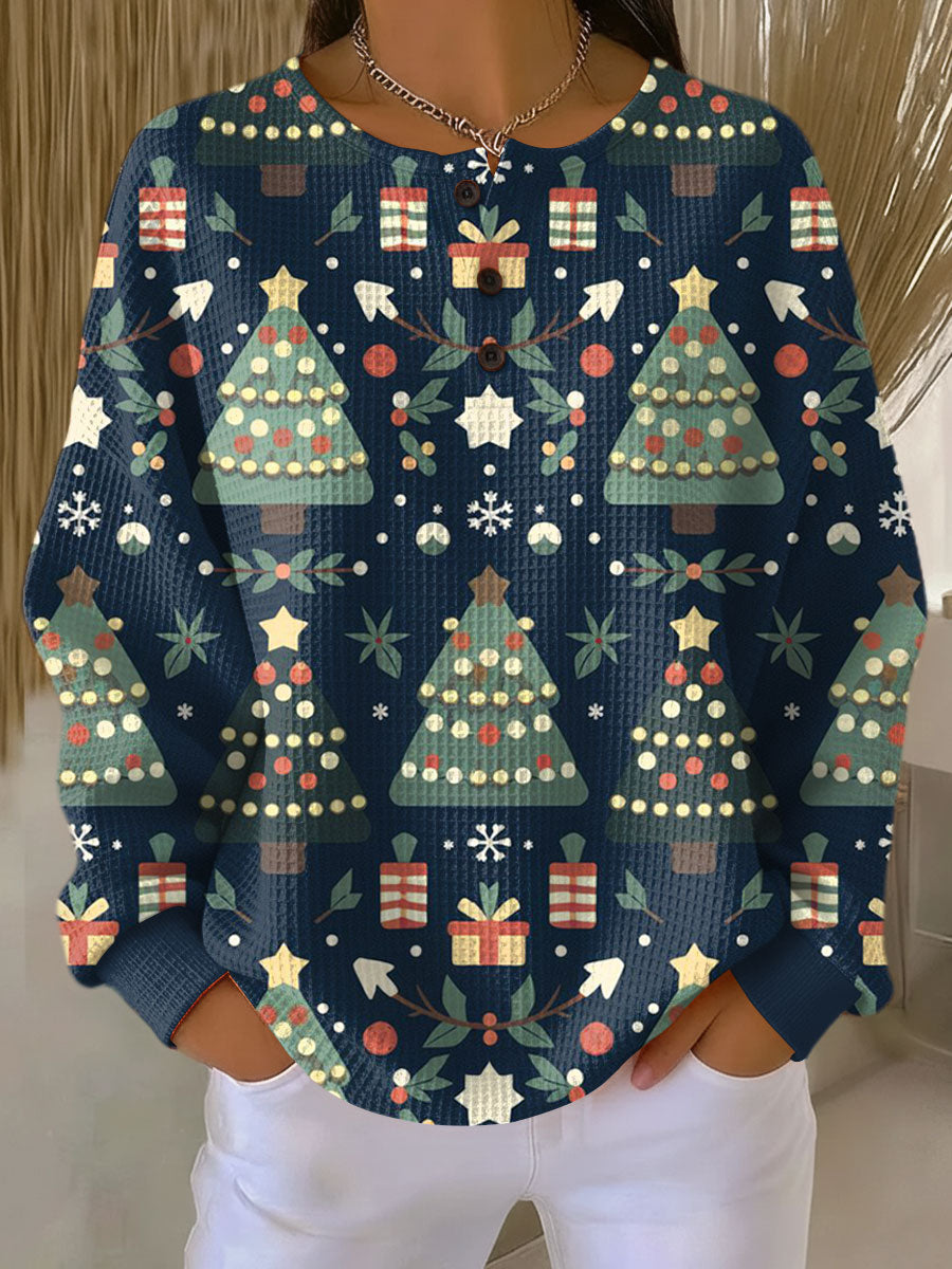 Navy waffle-knit henley jumper with festive trees and gift pattern and button placket