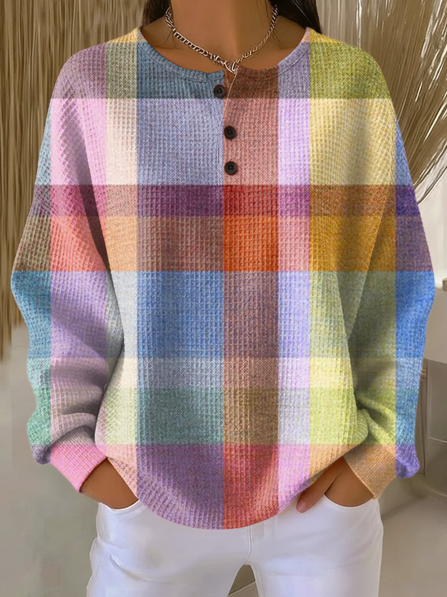 Pastel check plaid waffle-knit henley jumper with black button placket and long sleeves